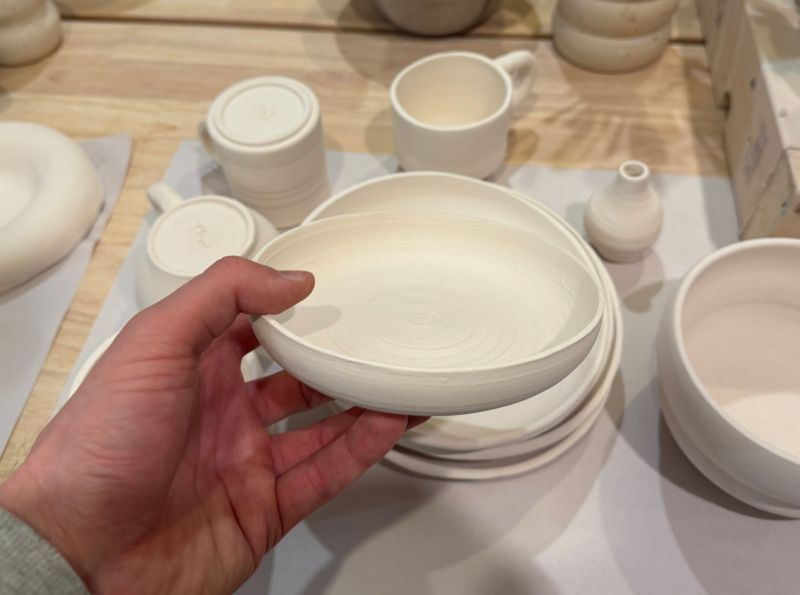 Hands at a pottery wheel